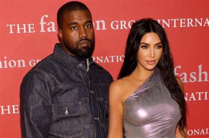 Kim Kardashian Stuns In A Bold Orange Look While Cozying Up With Kanye At The NBA All-Star Game